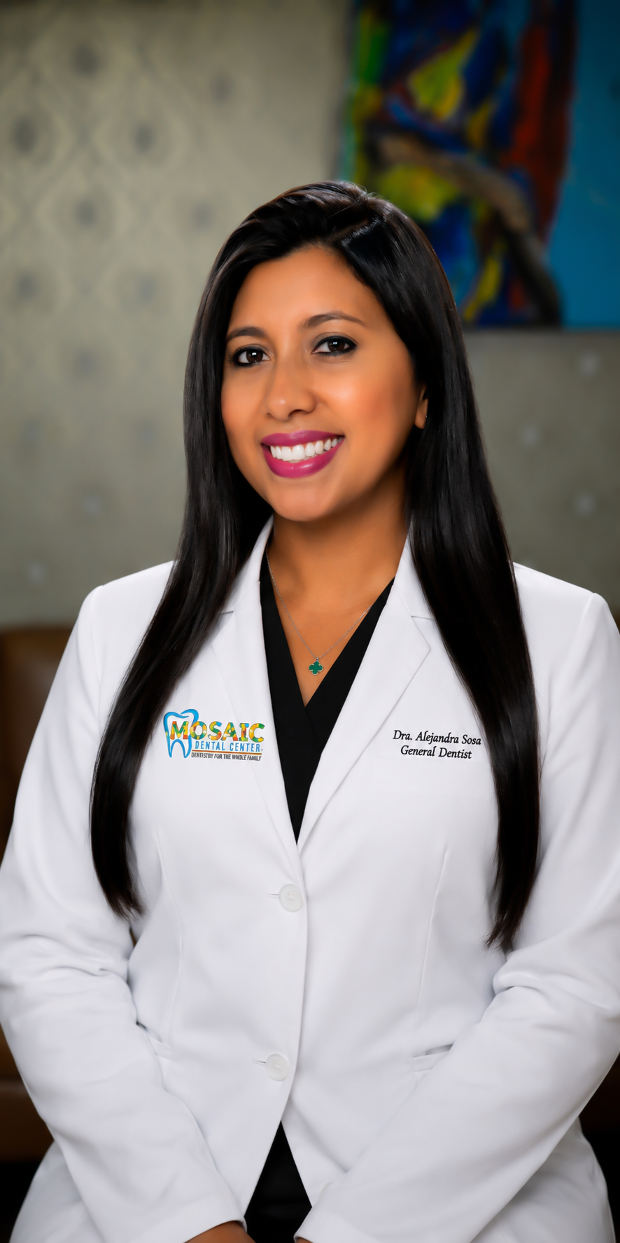 Psx_20260713_212752 - Mosaic Dental Center Smiling female dentist in a white lab coat, mosaic dental center branding visible on the chest